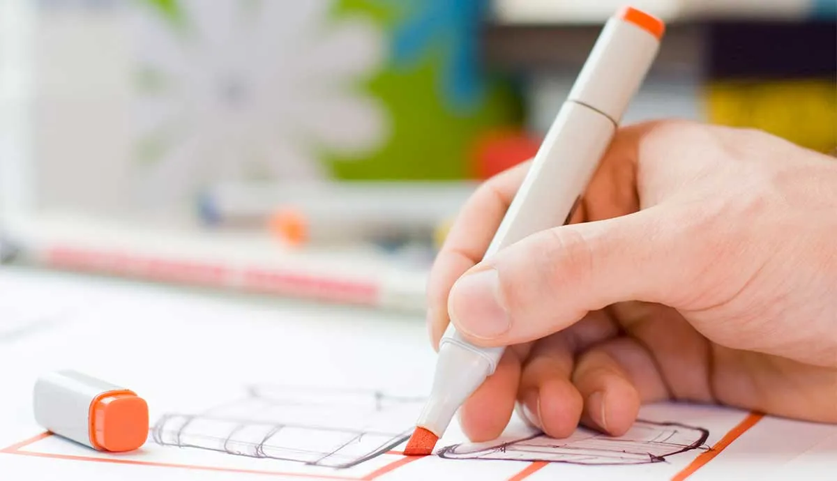 A designer drawing sketches