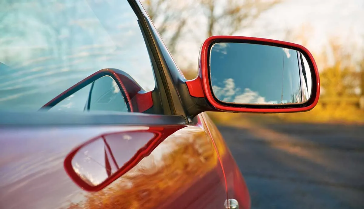 Red car focused on mirror